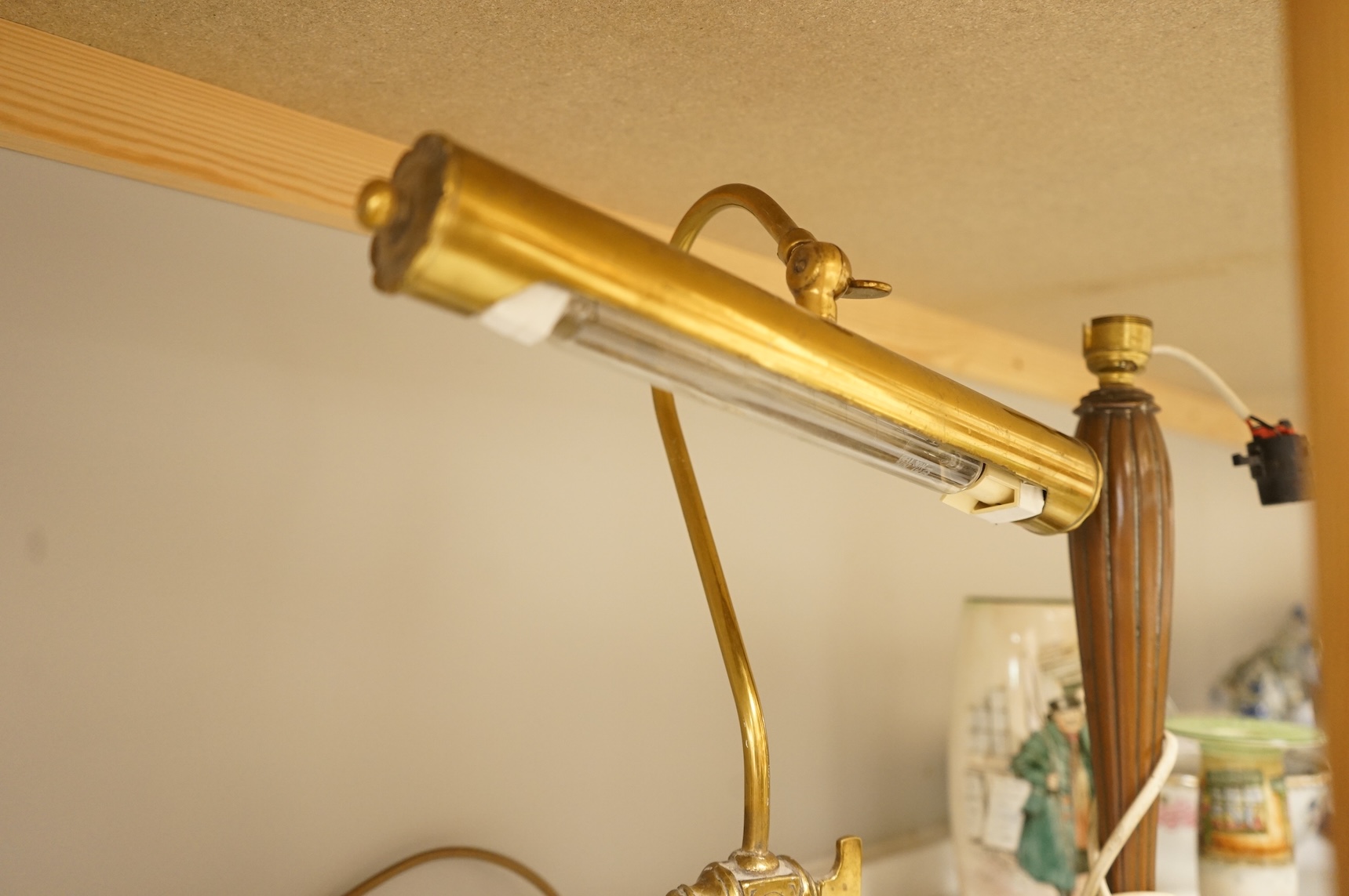 A copper table lamp and a brass students lamp